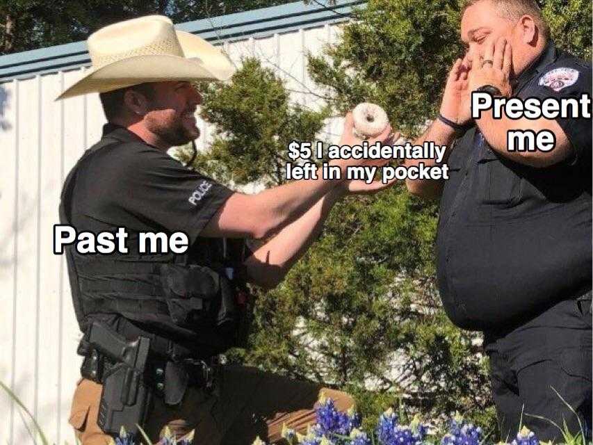 police officer giving a man a piece of food