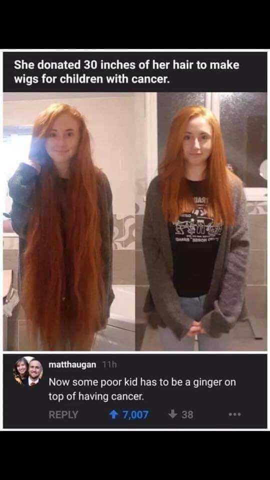 woman with long red hair standing in front of a mirror