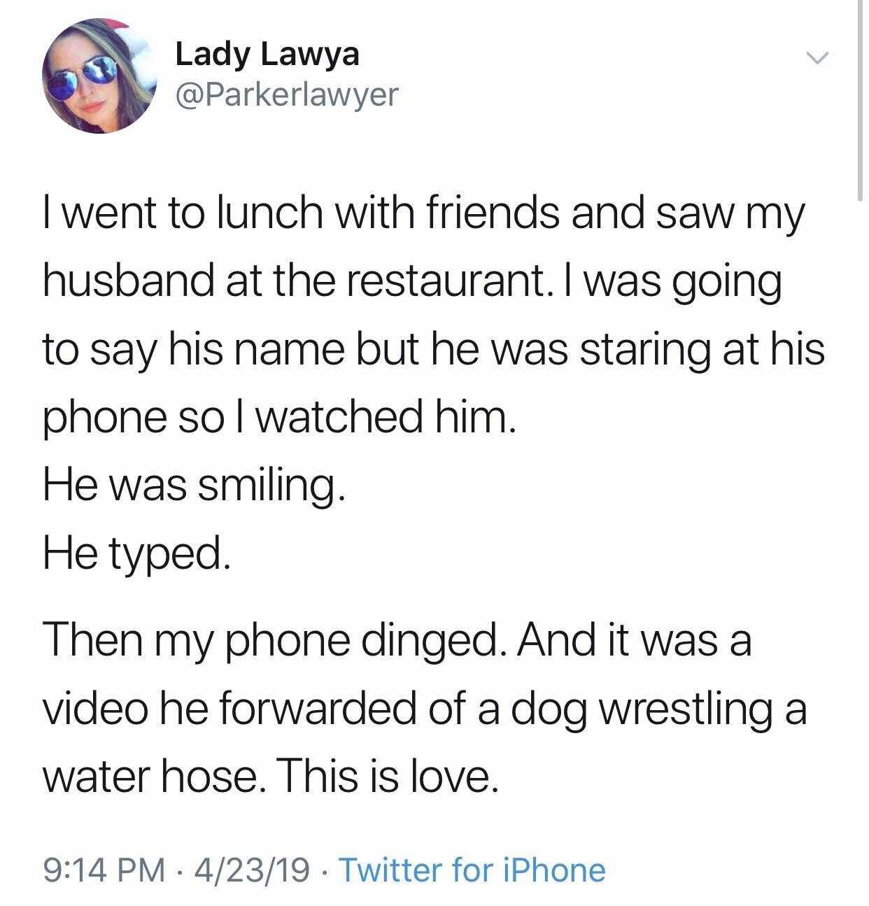 a tweet with a picture of a woman and a man on the phone