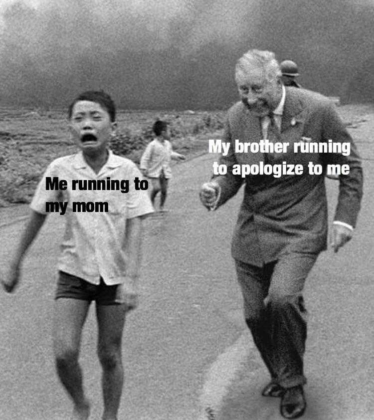 a black and white photo of a man and a boy running down a road