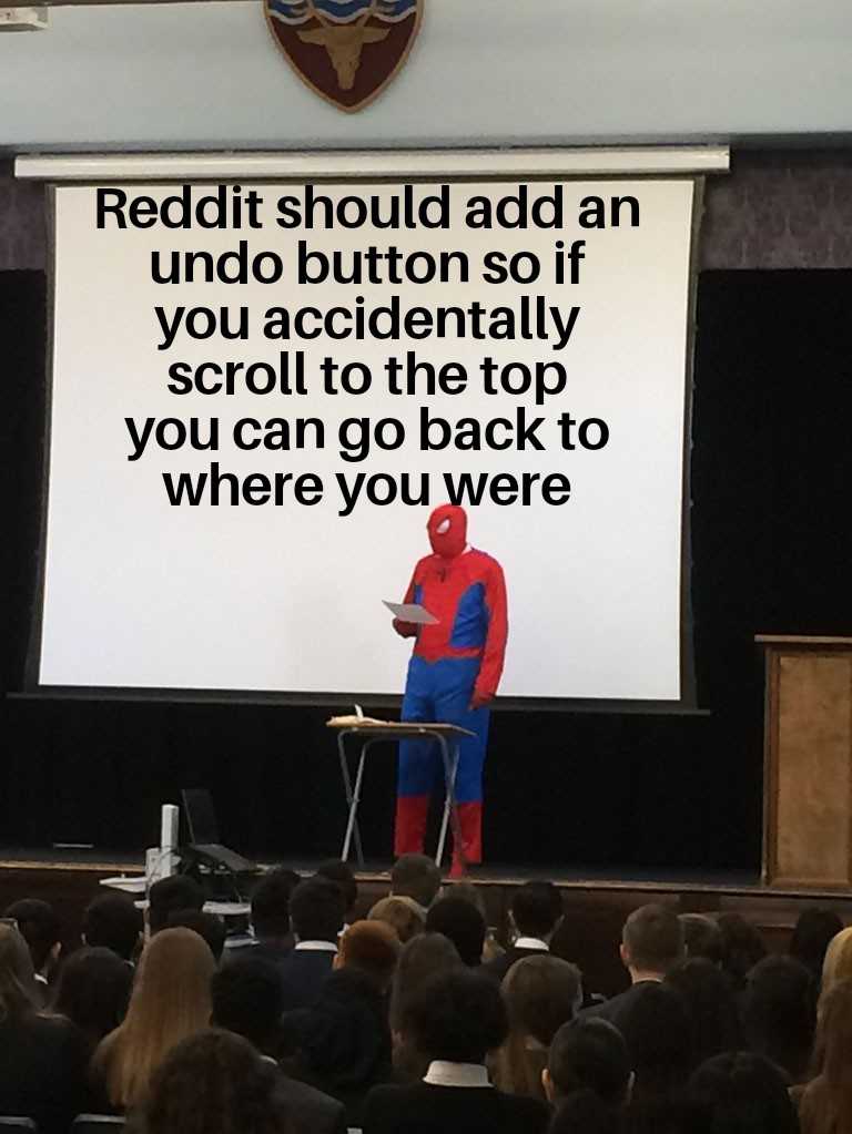 someone is standing on a stage with a screen and a spider man