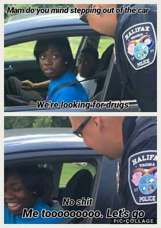 police officer talking to a young girl in a car