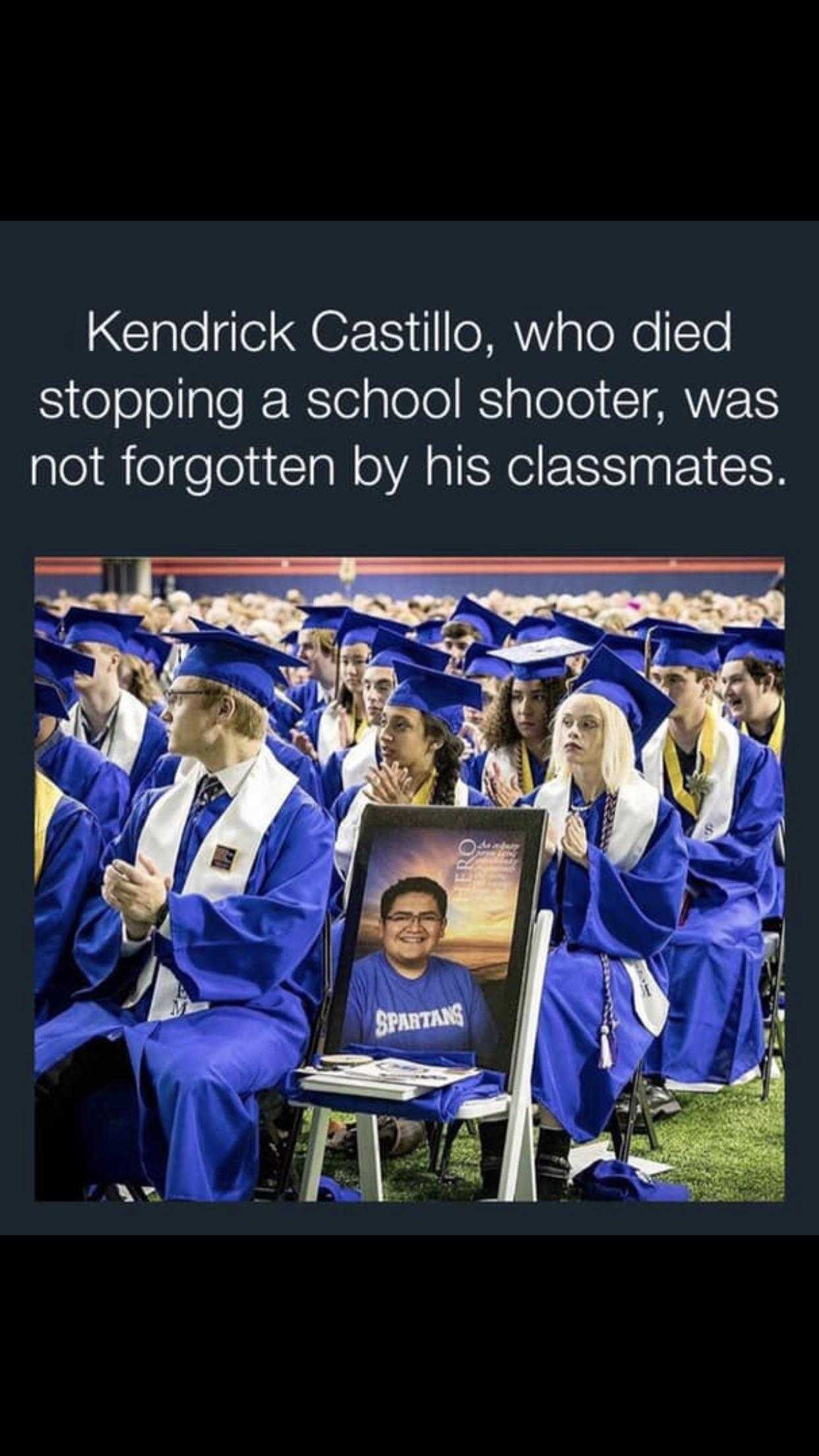 a picture of a group of graduates sitting in a row