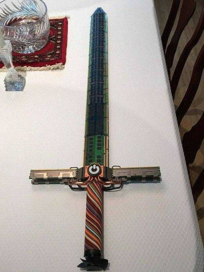 there is a cross made out of a tie on a table