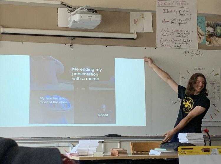 there is a woman standing in front of a whiteboard giving a presentation