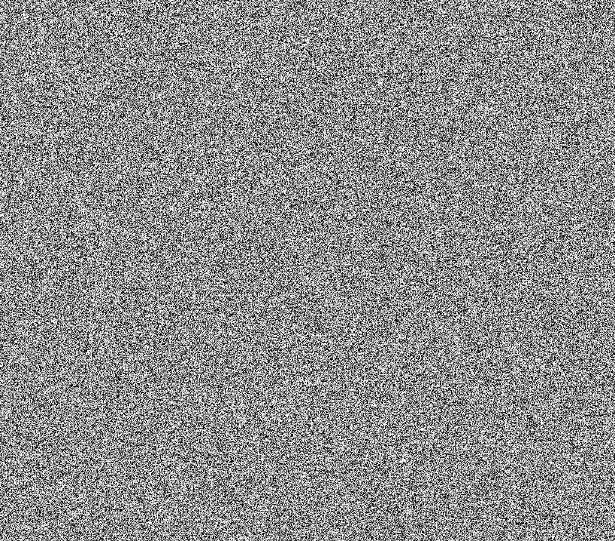 a close up of a gray surface with a small amount of small dots