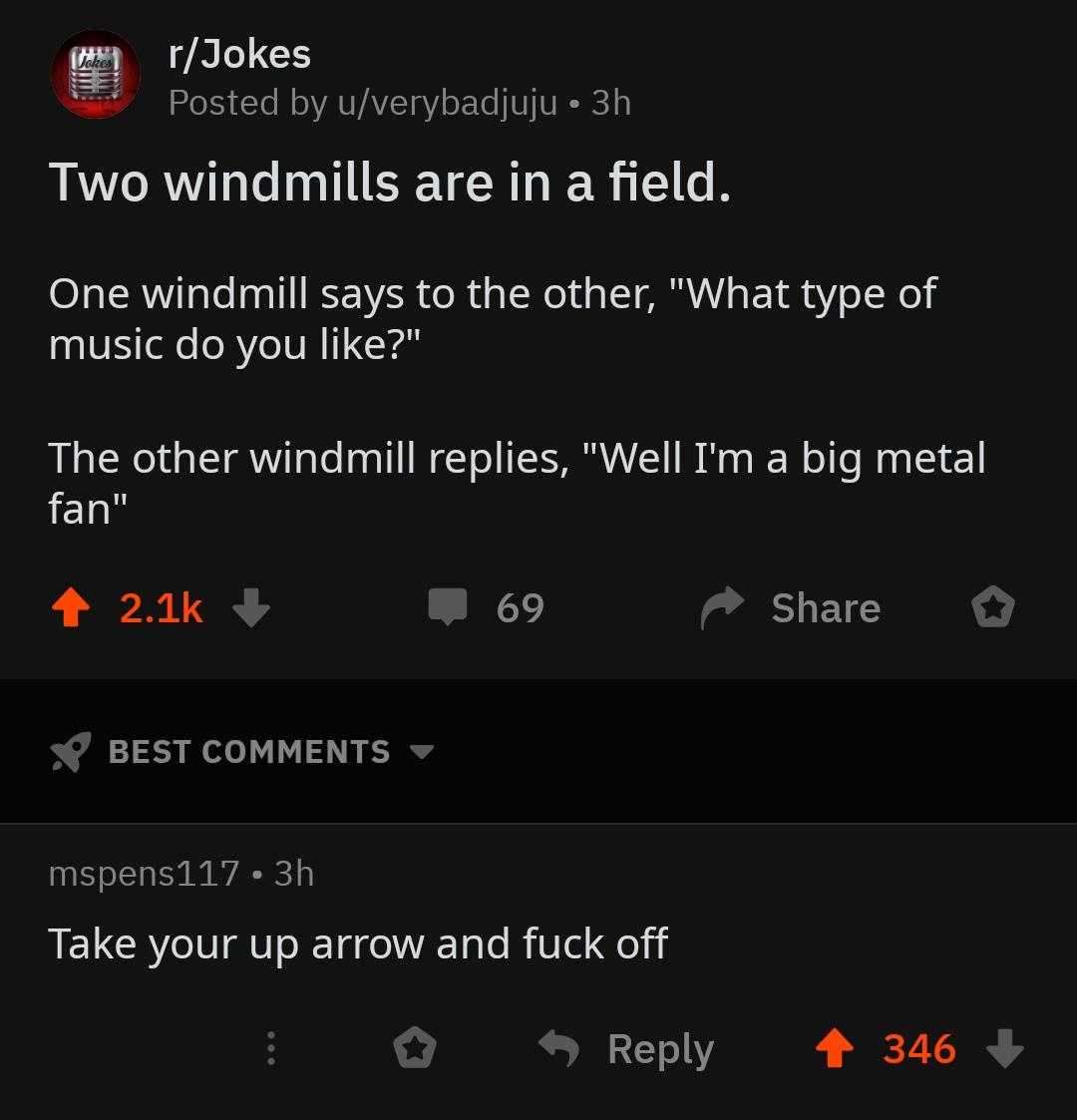 a screenshot of a tweet with two windmills and a field