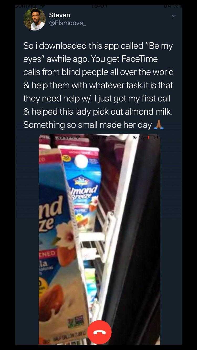 a close up of a person standing in front of a refrigerator