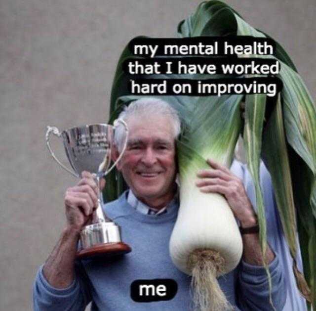 man holding a trophy and a trophy cup with a caption that reads, my mental health that i have worked hard on improving