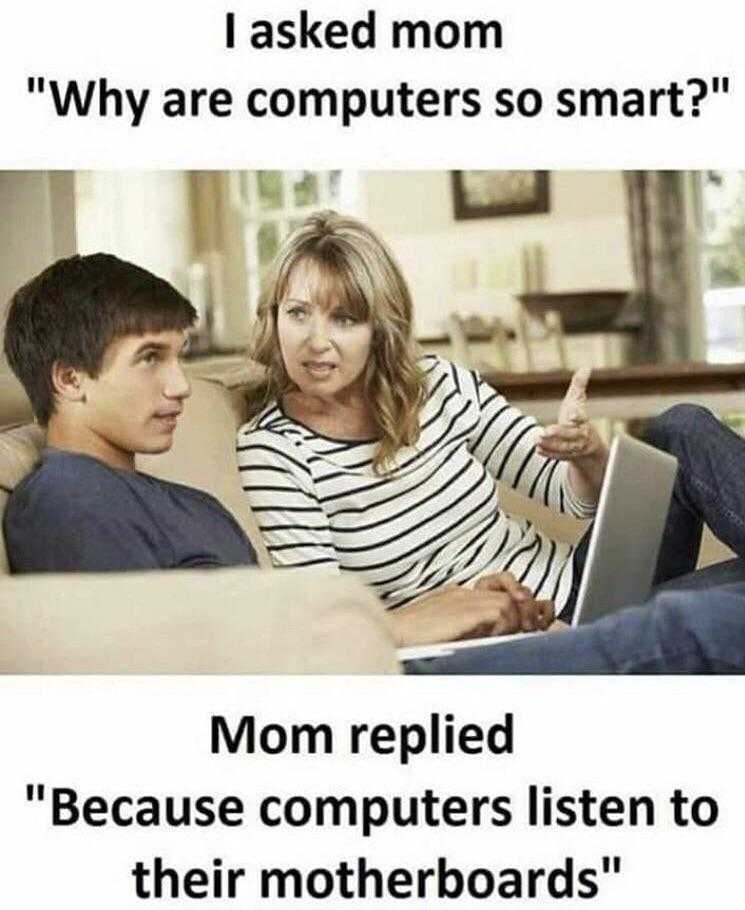 mom and son sitting on couch with laptop computer