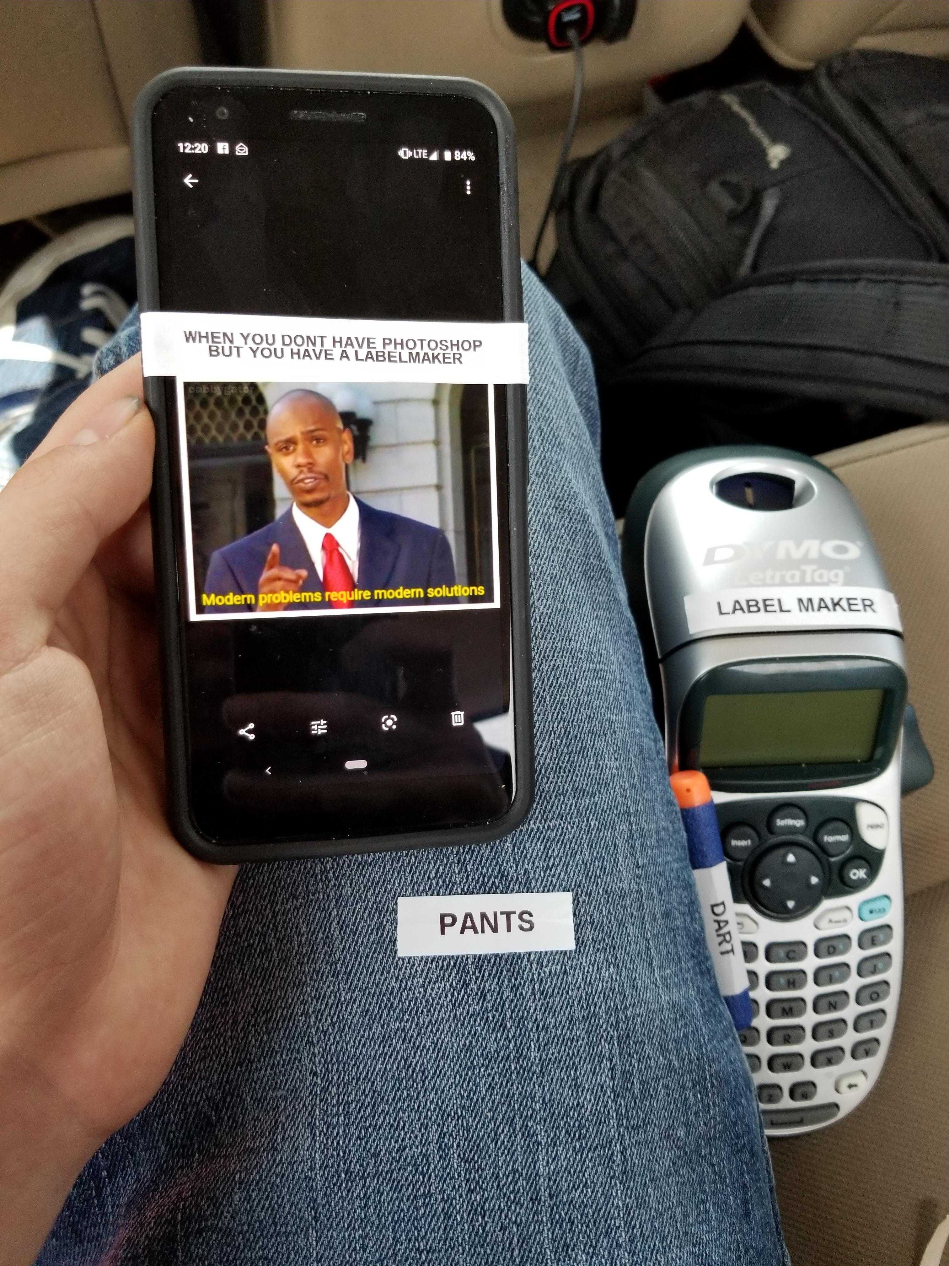 someone is holding a cell phone and a cell phone with a picture of president obama