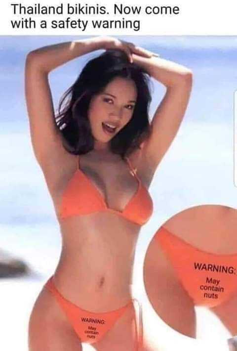 woman in a bikini with a warning sign on her chest