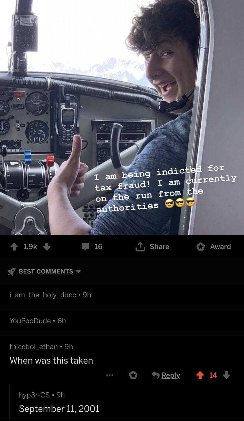 picture of a man sitting in a plane with a thumbs up