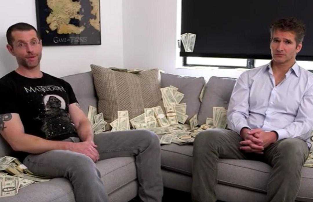 they are sitting on a couch with money all over them