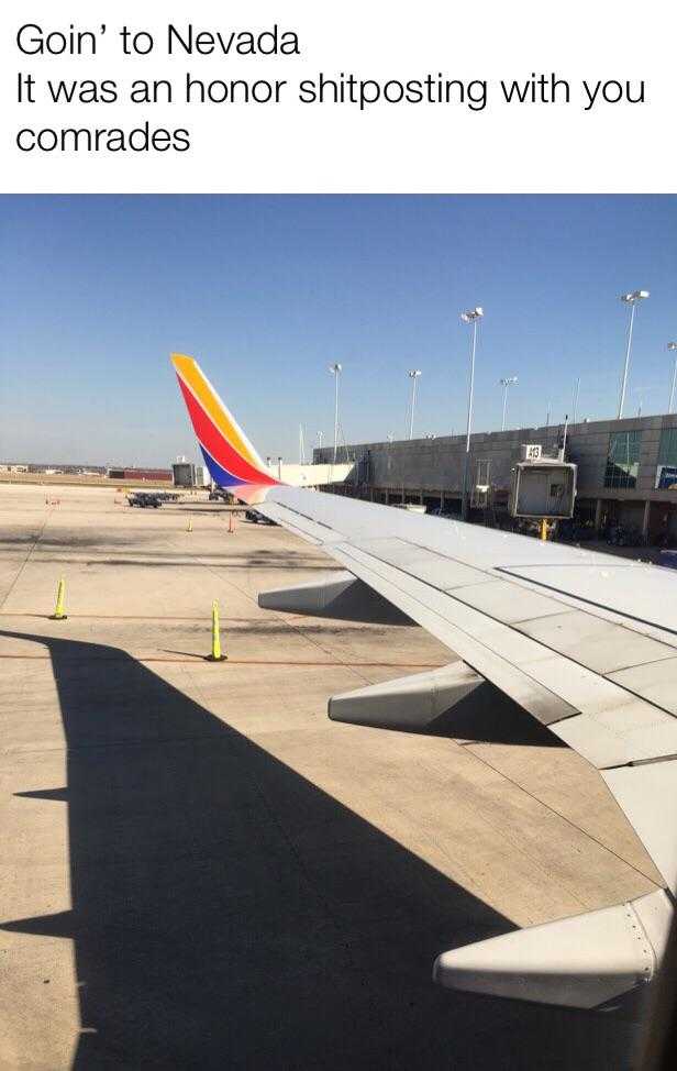 airplane wing with the shadow of a plane on the ground