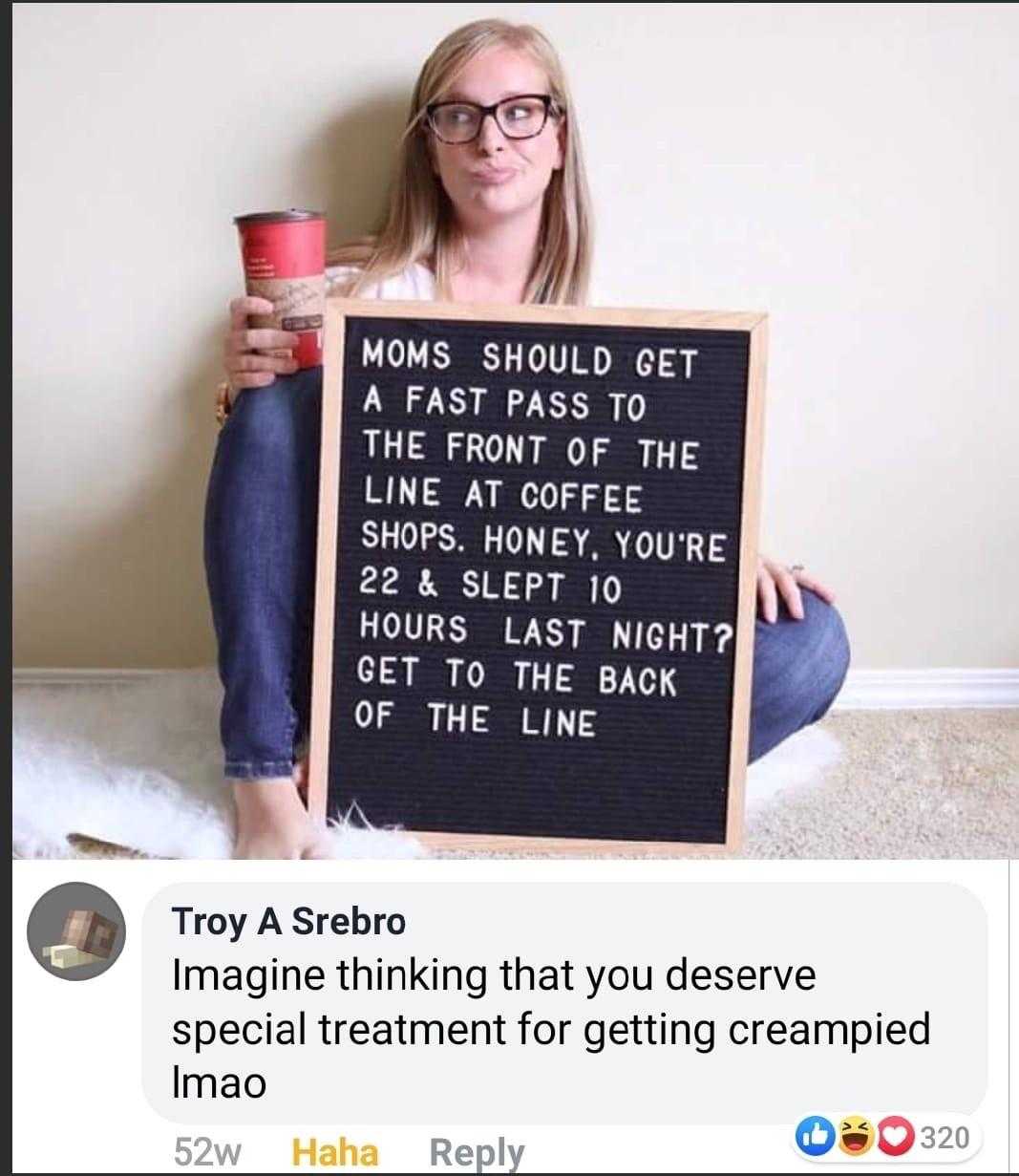 woman sitting on the floor holding a sign that says mom should get a fast pass to the front of the