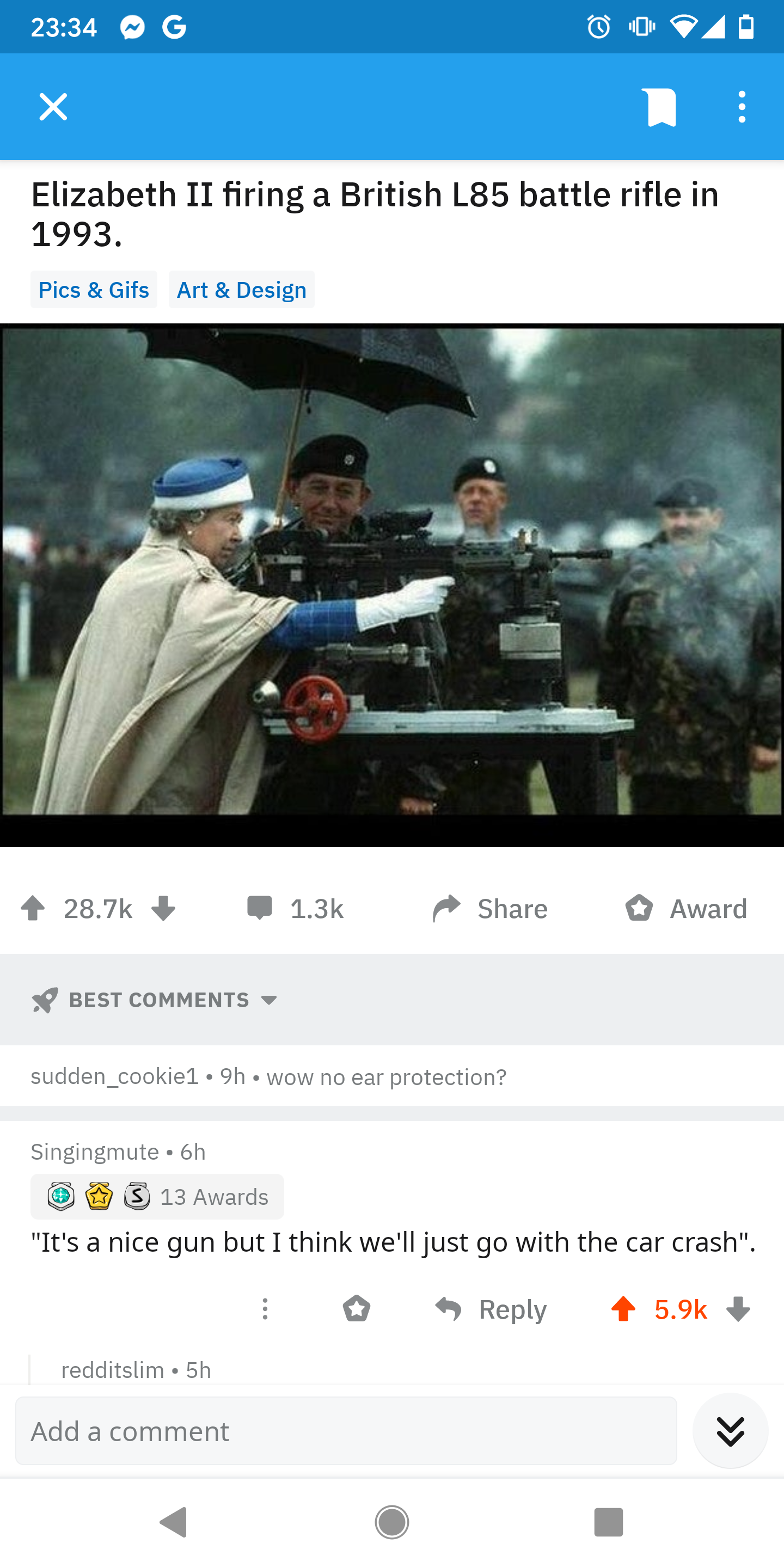 a close up of a person holding an umbrella near a military vehicle