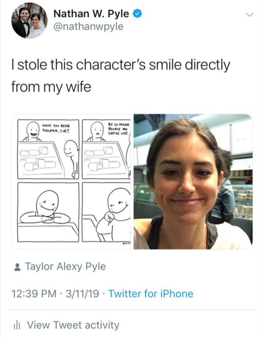 a woman is smiling and holding a phone with a cartoon drawing of a woman