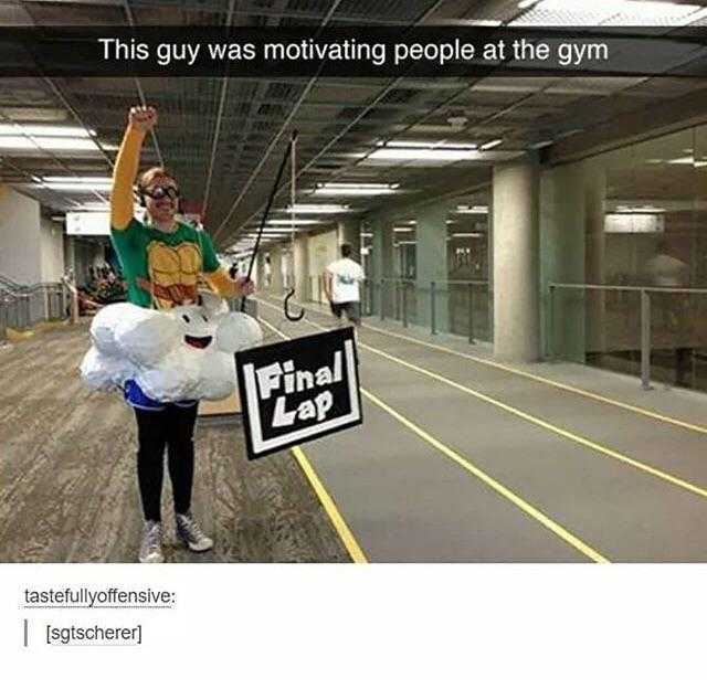 there is a man holding a sign that says this guy was motivgating people at the gym