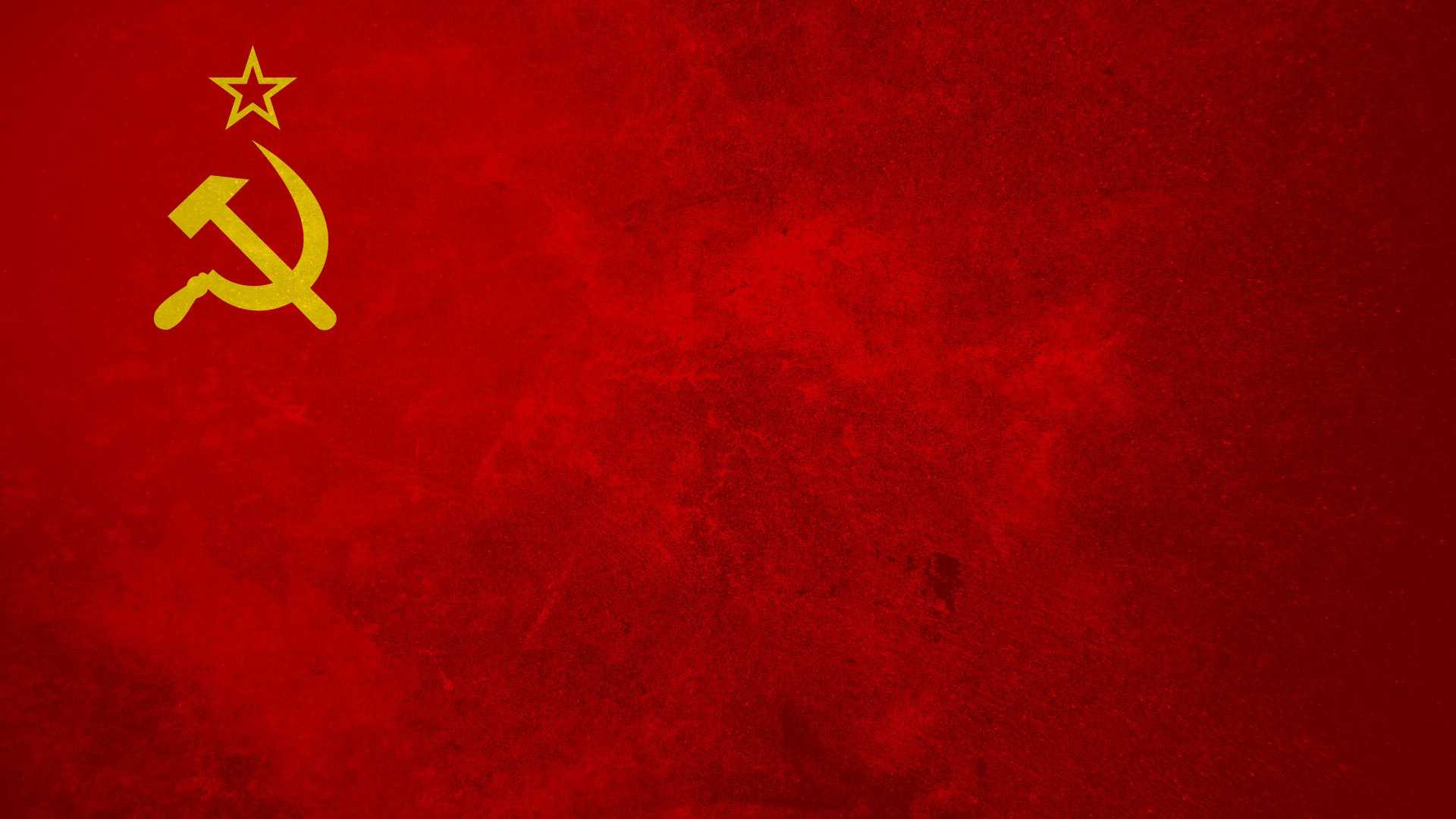 a red background with a hammer and sickle symbol on it