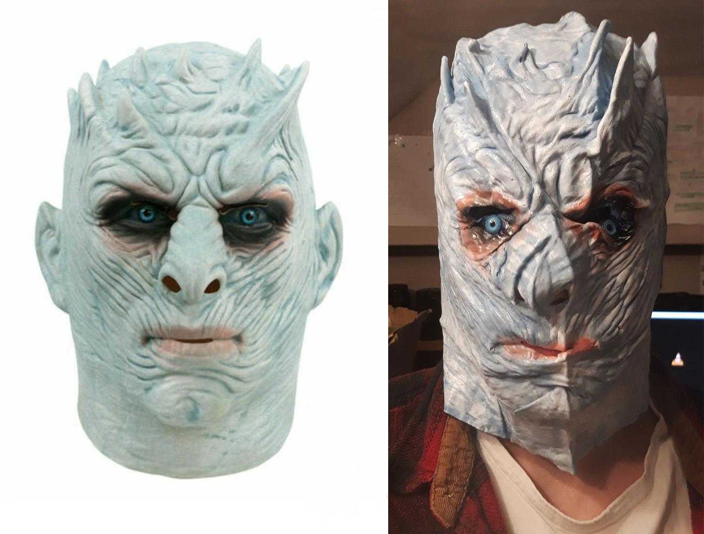 a close up of a person wearing a white walker mask