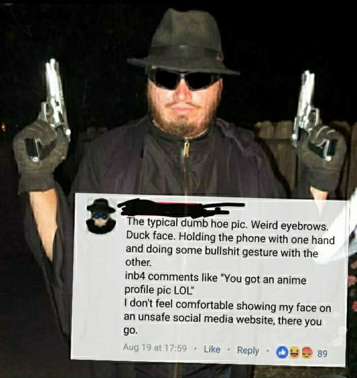 man in a fedora holding two guns and a sign