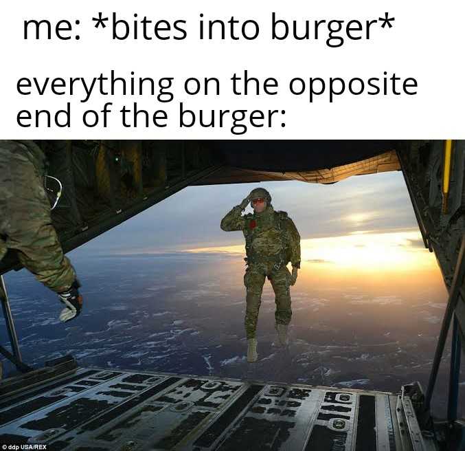 soldier in uniform standing on the back of a plane