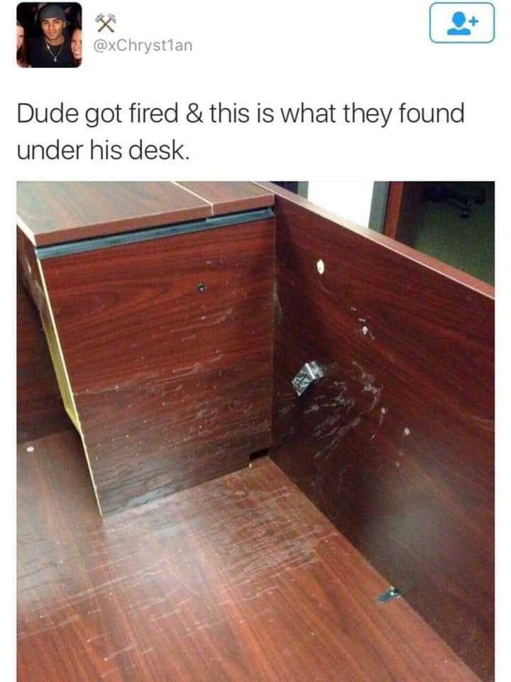 a close up of a desk with a wooden floor and a wooden cabinet