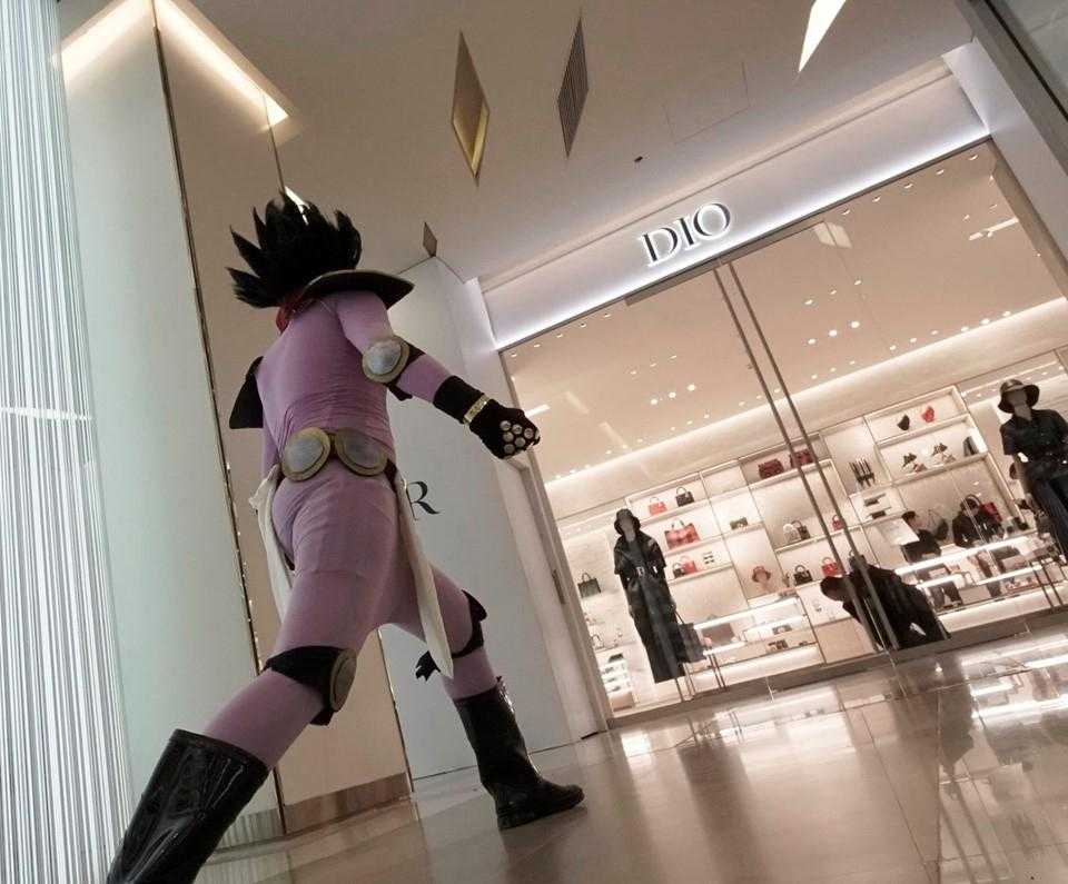 there is a woman in a pink costume walking in a mall