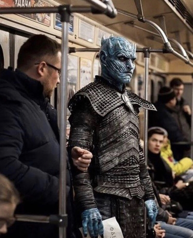 araffe dressed as a blue man on a subway train