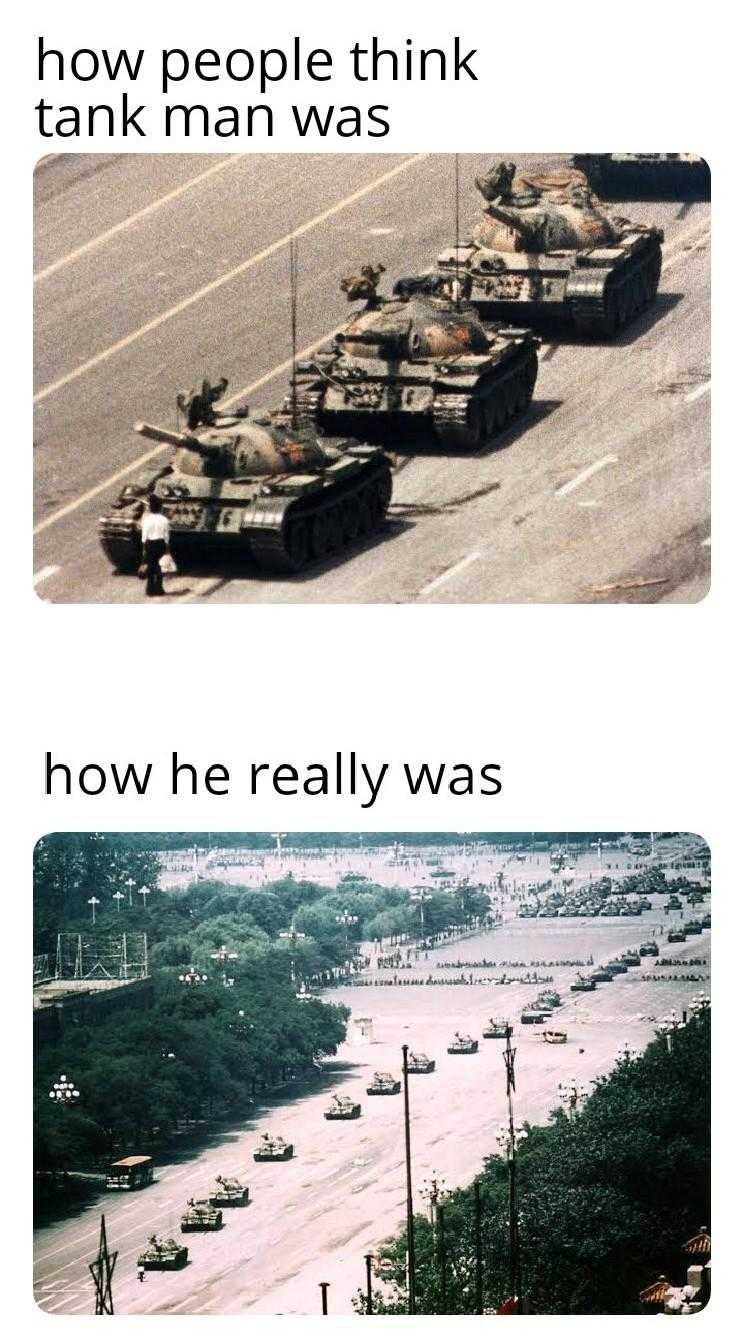 a picture taken from a video of tanks driving down a road