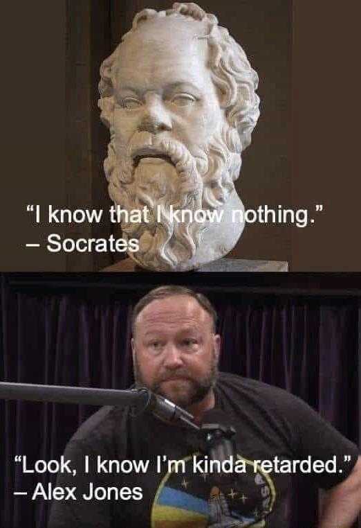 a close up of a person sitting in front of a statue