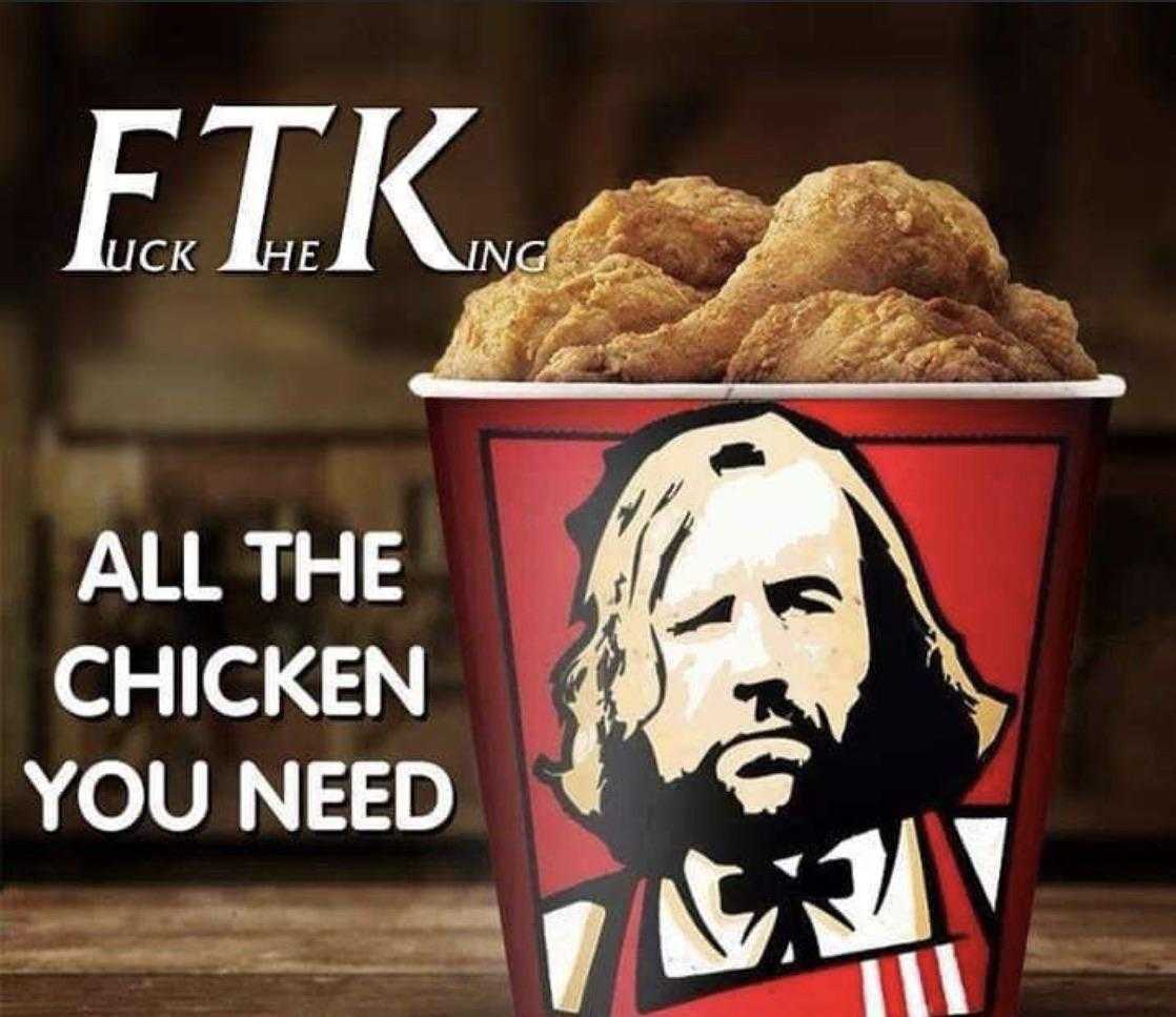 a close up of a cup of chicken with a picture of a man