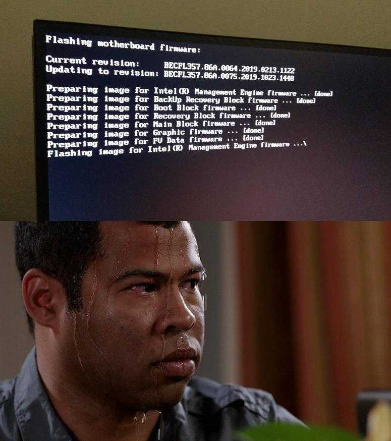 there is a man sitting in front of a computer screen