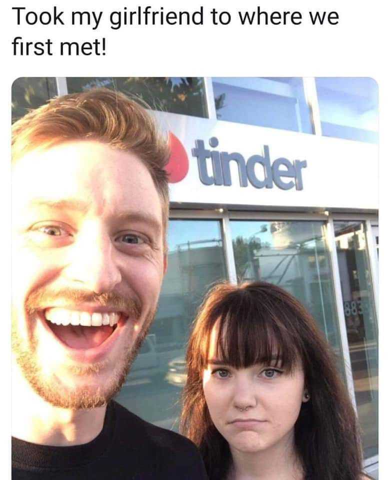 man and woman standing in front of a store