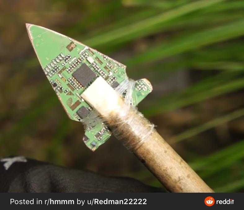 there is a small green object on a stick with a small piece of electronic board on it