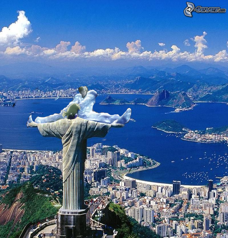 statue of jesus atop a mountain overlooking a city