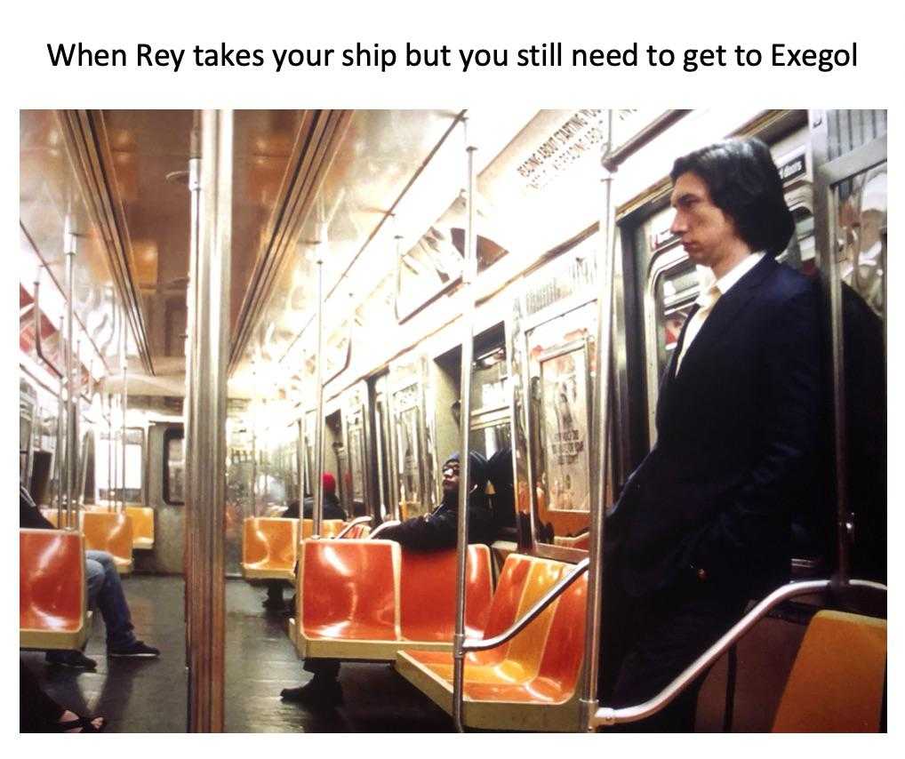 there is a man in a suit standing on a subway train