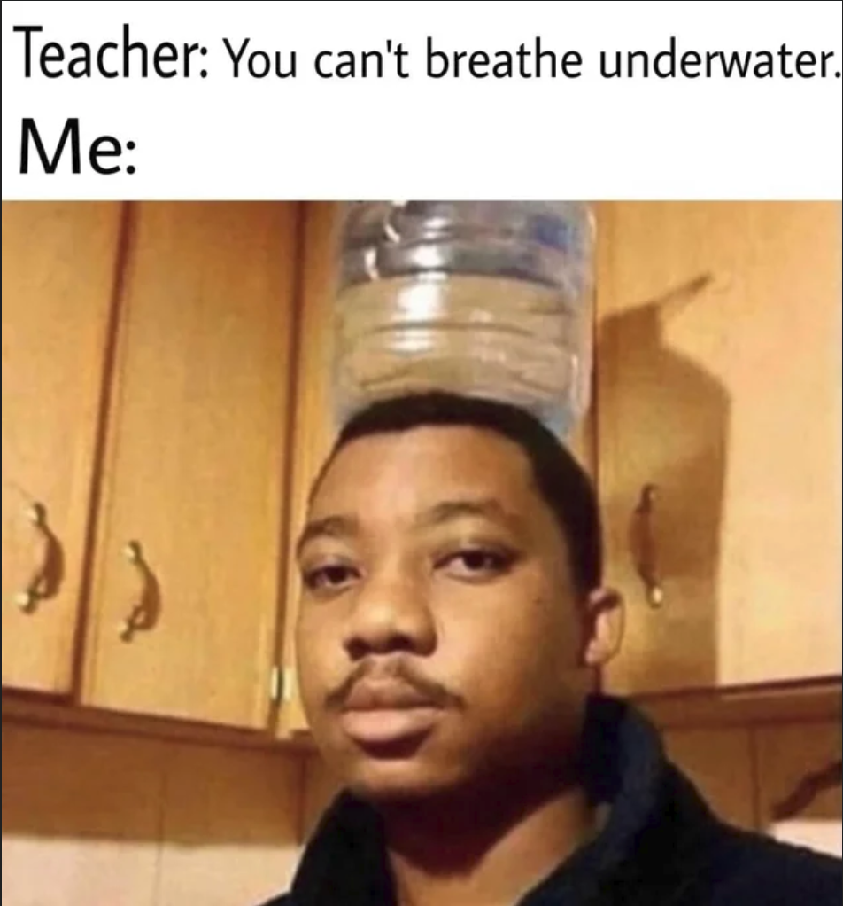 man with a water bottle on his head in a kitchen