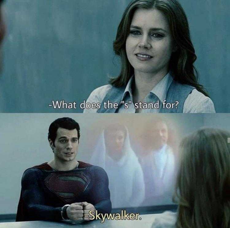 a woman in a superman suit is talking to a man in a suit