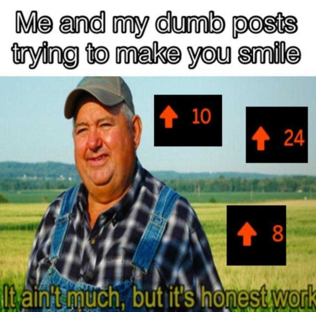 man in overalls and a cap standing in a field