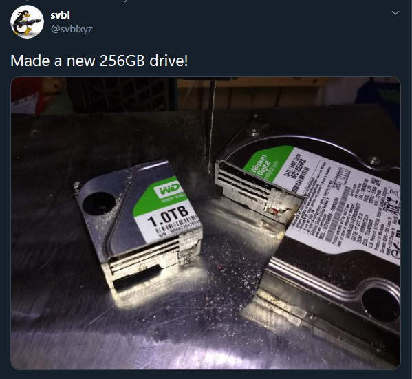 two hard drives are sitting on a table with a price tag