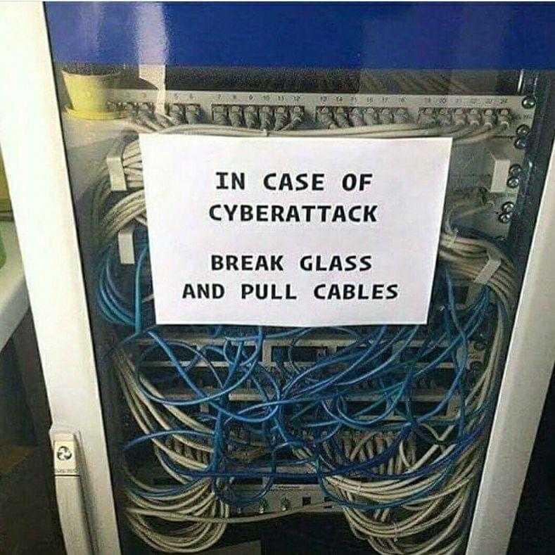 there is a sign that says in case of cyber attack break glass and pull cables