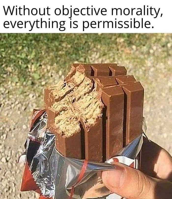 someone holding a chocolate bar with a bite taken out of it