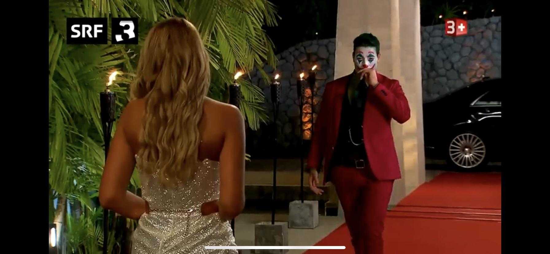 araffes dressed in a red suit and a woman in a white dress