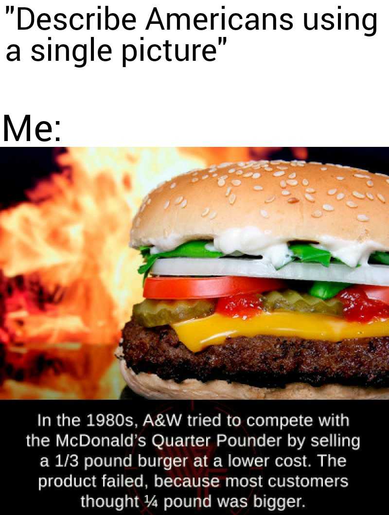 a close up of a hamburger with a fire in the background