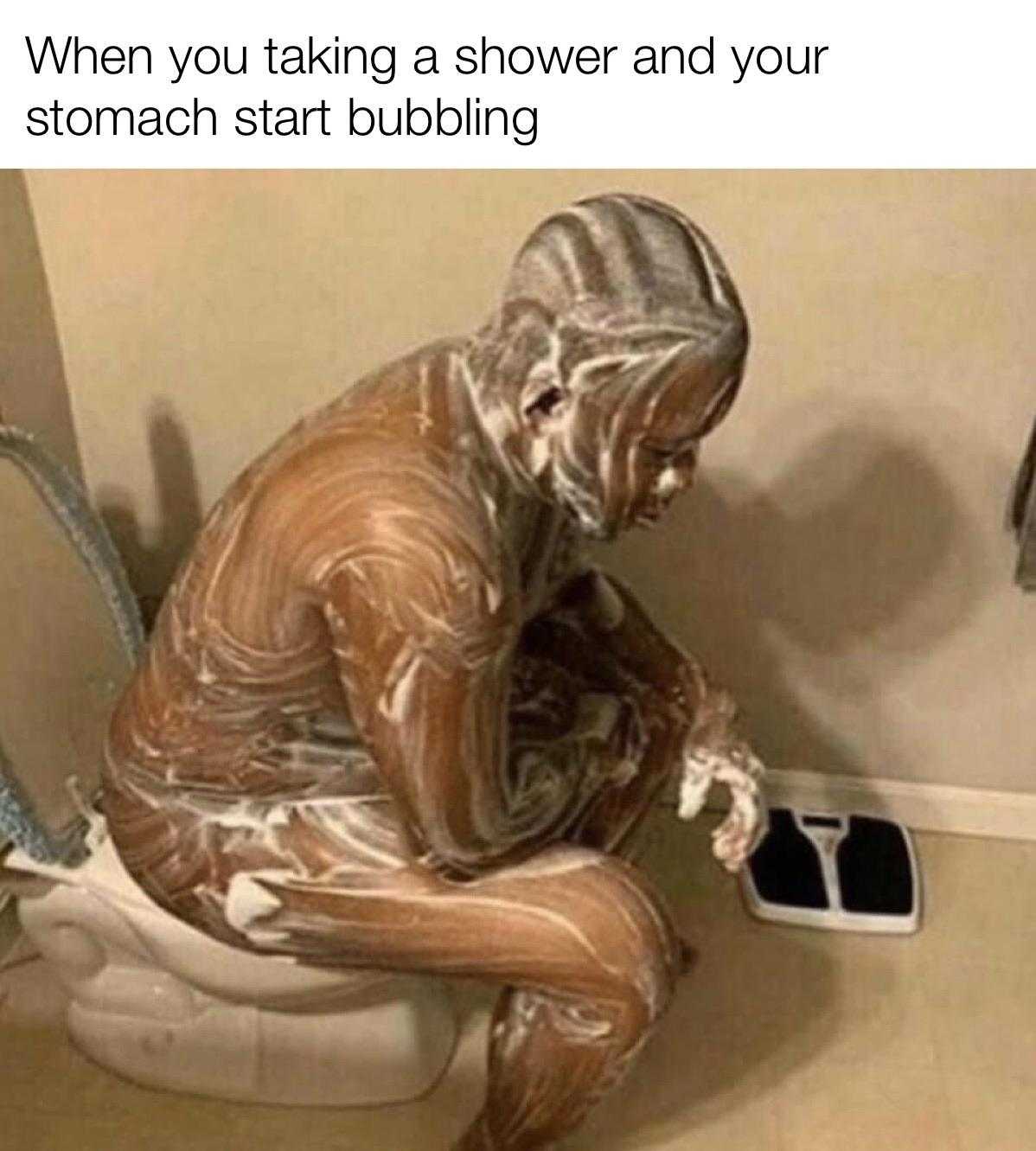 man sitting on a toilet with a body painted brown and white