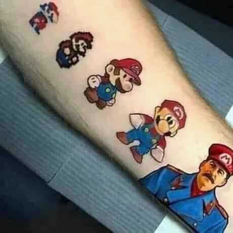 a close up of a person with a tattoo of mario and luigi