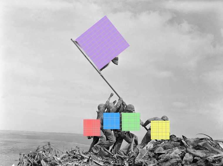 a black and white photo of a group of people holding up a flag