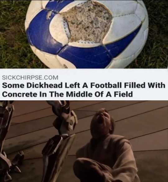 a close up of a soccer ball with a person sitting on the ground